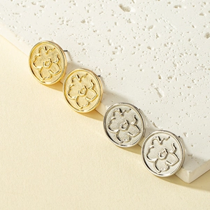 Elegant floral embossed round stud earring set in gold and silver plating on stone