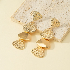 Golden vintage geometric shield drop earrings with hammered texture and polished metal finish