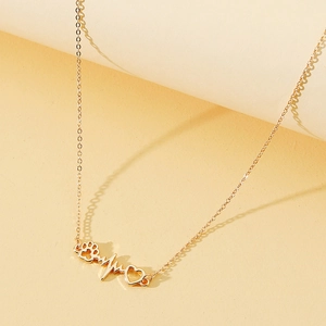 Gold-tone necklace with minimalist heart, heartbeat, and pet paw pendant on cross chain