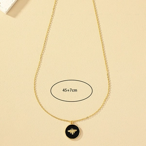 Gold bee pendant necklace with black enamel disc and adjustable 45+7cm chain