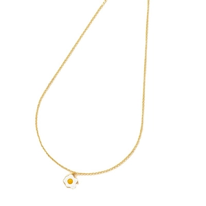 Fashionable golden chain necklace with creative enamel fried egg pendant on white background