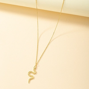 Minimalist gold snake pendant necklace with zircon crystals on a fine chain