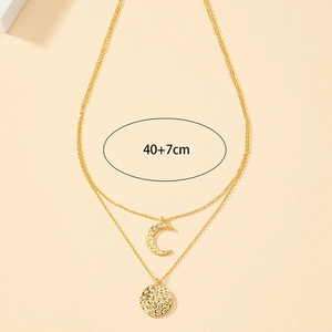 Gold layered necklace with hammered round coin and crescent moon pendants, 40+7cm length