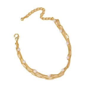 Bracelet à double chaîne dorée avec perles blanches et fermoir mousqueton ajustable