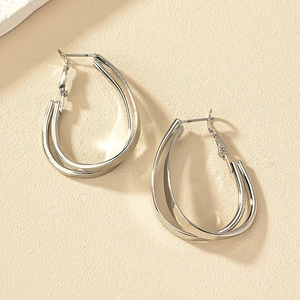 Boucles d'oreilles créoles gouttes double couche en argent avec finition métal poli