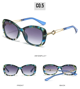 Detail showing gradient purple lenses and gold metal temples with hollow design