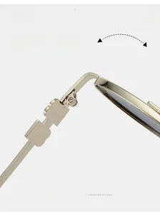 Detail of durable texture hinge on oval metal frame sunglasses showing smooth opening mechanism
