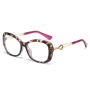 Modern cat-eye sunglasses with tortoise frame, gold metal temples and blue lenses