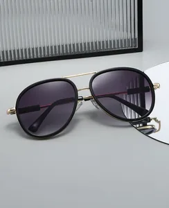 Detail of oversized pilot sunglasses with dual-bridge frame and purple gradient lenses