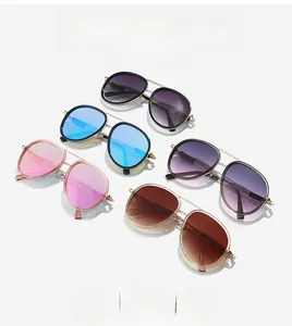 Close-up of stylish double bridge aviator sunglasses in multiple gradient lens colors