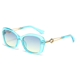 Women's butterfly sunglasses with light blue frames and gold metal temple detail