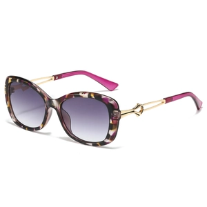 Chic butterfly oversized sunglasses with purple tortoiseshell frames and gold temples