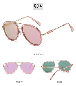 Detail view of double bridge aviator sunglasses with gold frames and colorful lenses