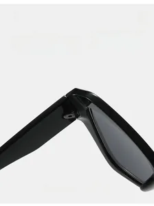 Detailed close-up of a durable texture hinge on black glossy polygon sunglasses