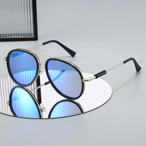 2025 pilot sunglasses with gold metal frame and blue mirrored lenses on a round base