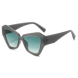 Chic oversized geometric cat-eye sunglasses with translucent taupe frames and gradient lenses
