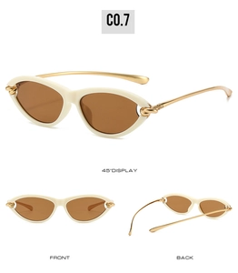 Detailed views of cream cat-eye sunglasses with gold metal knot temples and brown lenses