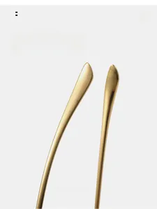 Detail of golden metal curved temples designed for ergonomic and comfortable sunwear