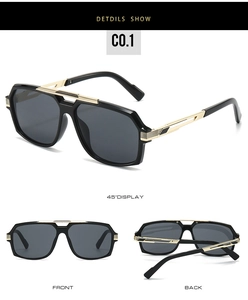 Detail view of black square sunglasses with gold metal accents and striped temples