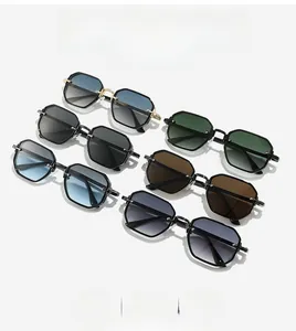 Flat lay of six colorful polygonal sunglasses including gradient blue and green lenses