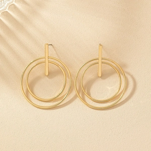 Minimalist geometric gold earrings with double circular hoops and long vertical metal bars