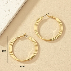 Elegant 4cm golden triple-layer twisted hoop earrings with a minimalist metallic finish