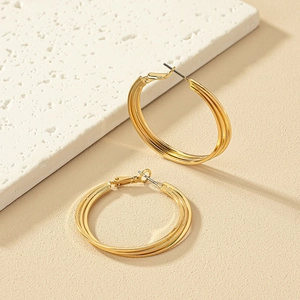 Elegant gold multi-layer twisted hoop earrings with a textured triple-ring design