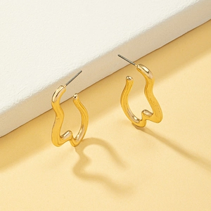 Abstract wave gold drop earrings with minimalist irregular curved metal design