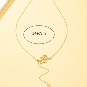 Collier élégant avec pendentif feuille ajourée et perle en forme de Y doré