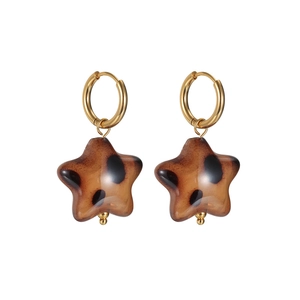 Vintage leopard print star earrings with golden metal loops and amber resin star charms