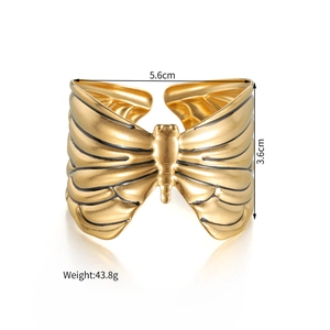 Detailed view of golden butterfly bangle dimensions showing 5.6cm diameter and 43.8g weight