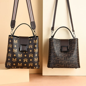 Classic dark brown bucket bag with gold logo prints and stylish stripe fabric shoulder strap