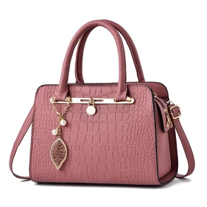 Deep pink crocodile texture tote bag with gold leaf pendant and pearl accents