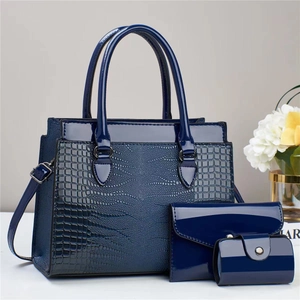 Navy blue 3-piece lizard pattern handbag set with tote, clutch and coin purse