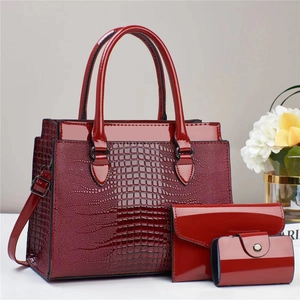 Three-piece red lizard pattern glossy leather handbag set with tote and clutch bag