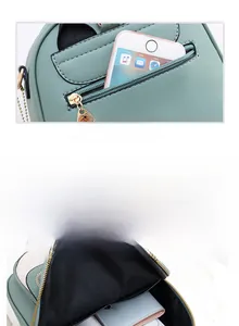 Detail of mint green crossbody bag with rear zipper pocket and multi-layer inner storage