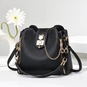 Chic black elephant texture leather bucket bag with golden cat-shaped lock and chain strap