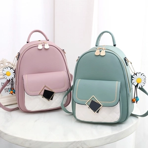 Fashionable mini backpacks in pink and green with quilted diamond pattern and daisy charms