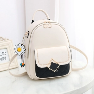 Chic cream white leather backpack with black quilted pocket and daisy charm detail