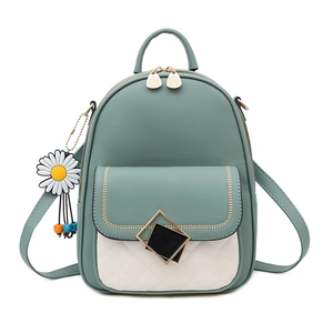 Fashionable green and beige mini backpack with quilted pattern and daisy charm accessory