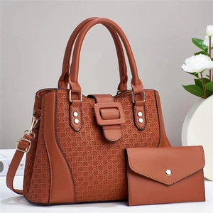 Caramel tan tote and wallet set featuring woven texture and golden hardware details