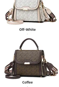 Detail of elegant handbags in white and coffee colors with canvas strap and metal buckle