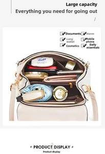 Internal view of beige crossbody bag with compartments for essentials and wide capacity