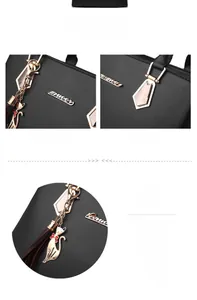 Detail of black pebbled leather tote with gold logo and cat pendant with tassel