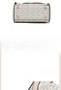 Detail of the handbag base with golden protective studs and a premium metal zipper slider