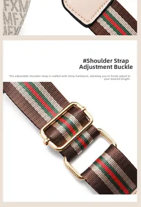 Detail of adjustable canvas shoulder strap with red green stripes and gold hardware