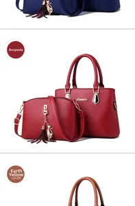 Detail of burgundy leather tote bag set with metal cat pendant and tassel accessory