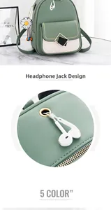 Detail of Korean style green backpack showing the functional headphone cable port hole
