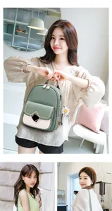 Detail of green and beige quilted fashion backpack with daisy charm and metal buckle