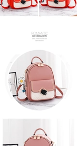 Detail view of pink and beige patchwork backpack with floral zipper and geometric buckle